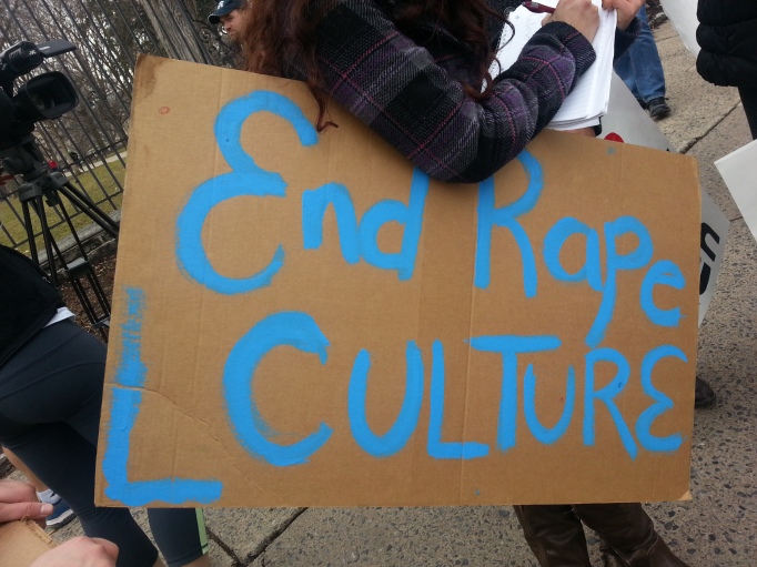 Picture of a sign at the Window of Opportunity rally that says "End Rape Culture."
